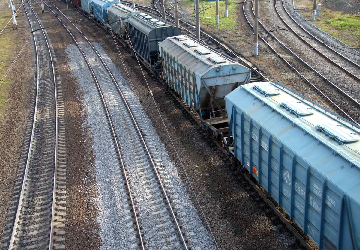 Covered hopper wagons standing on marshalling tracks, seen from above.